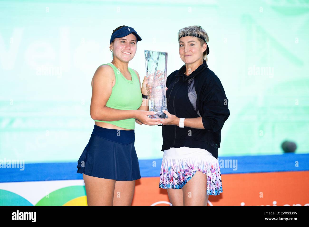IAMI GARDENS, FLORIDA - MARCH 31: Sofia Kenin of the United States and Bethanie Mattek-Sands of the United States pose with their champions trophy after defeating Gabriela Dabrowski of Canada and Erin Routliffe of New Zealand in the women’s doubles final of the Miami Open Presented by Itau at Hard Rock Stadium on March 31, 2024 in Miami Gardens, Florida. (Photo by Mauricio Paiz) Credit: Mauricio Paiz/Alamy Live News Stock Photo