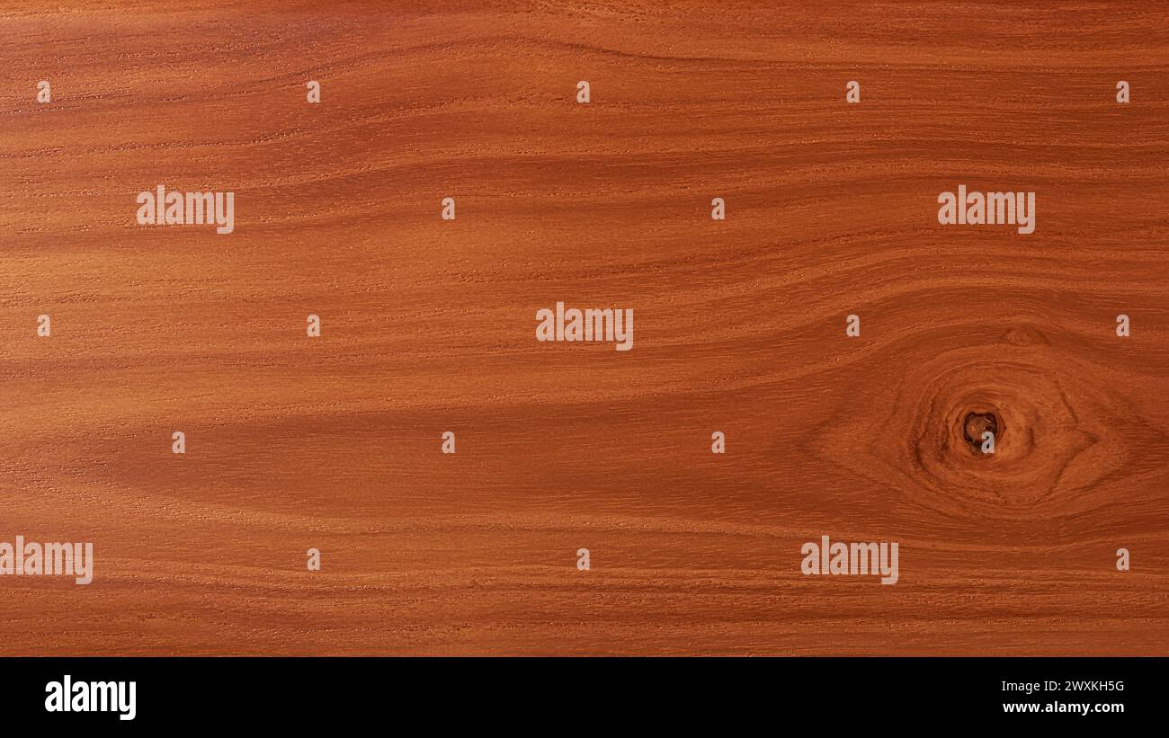 teak wood board surface grain with knot, full frame background texture, dark brown textured backdrop for graphic designing with copy space Stock Photo