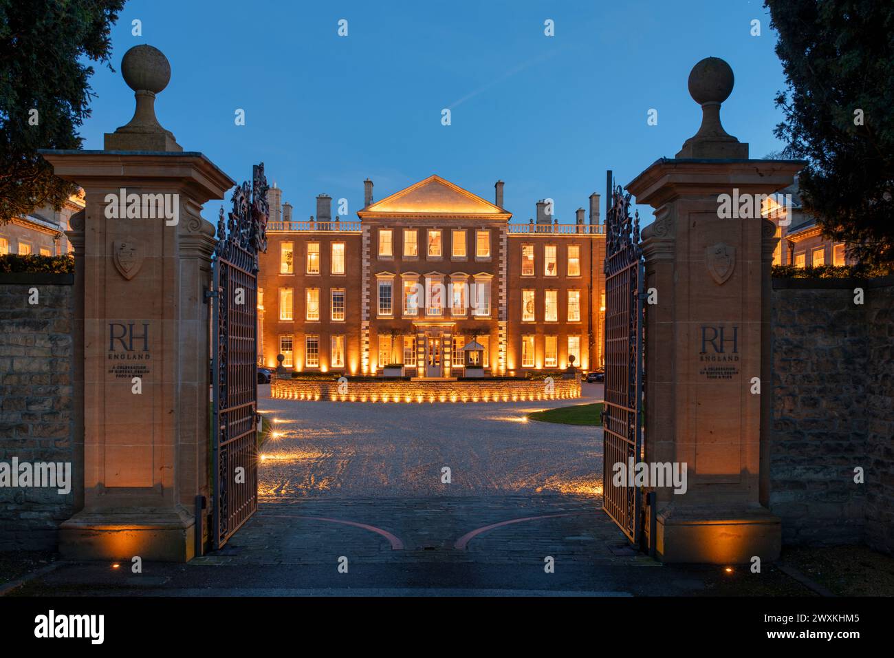 Aynho Park, Grade I listed 17th century country house lit up at dusk. Aynho, Northamptonshire, Oxfordshire, England Stock Photo