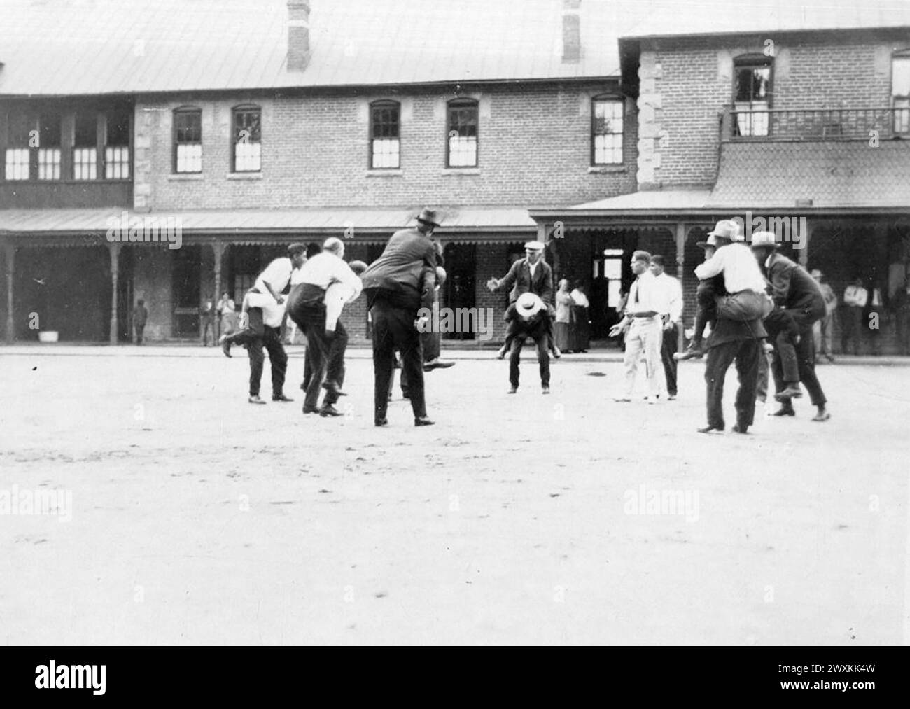 Men Playing “Piggy-Back” ca. 1912-1917 Stock Photo