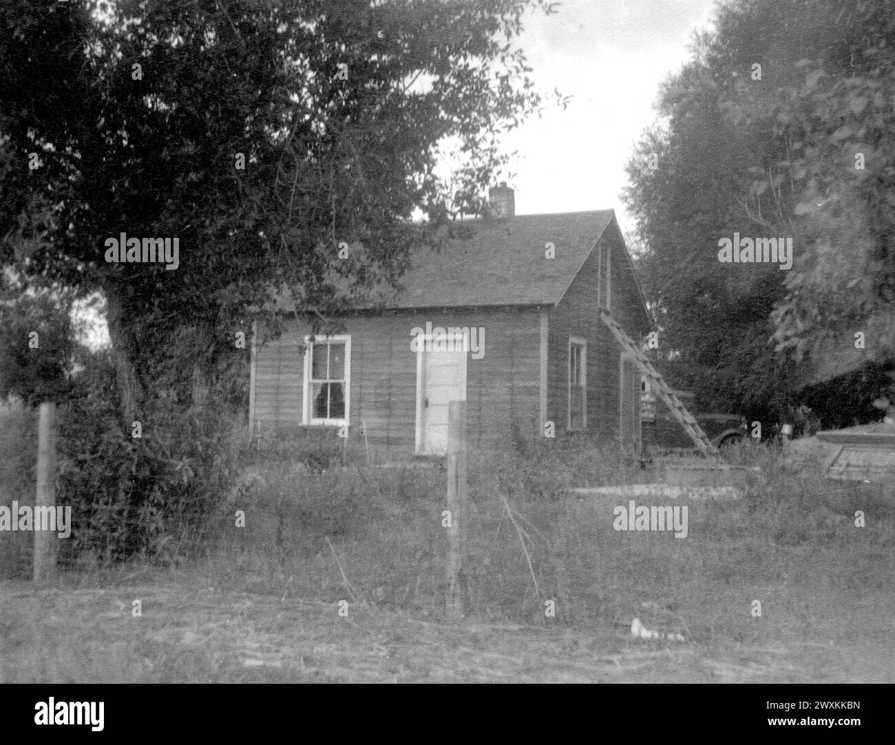 Small house with ladder leaning against a window, possibly on the Wind ...