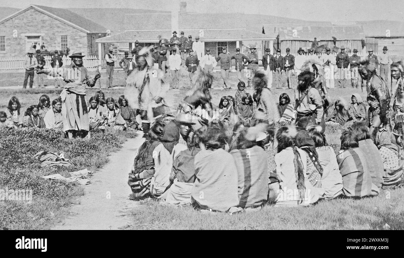 Shoshone Indians at Ft. Washakie, Wyoming Indian Reservation . . . Chief Washakie (At Left) Extends His Right Arm ca. 1892 Stock Photo