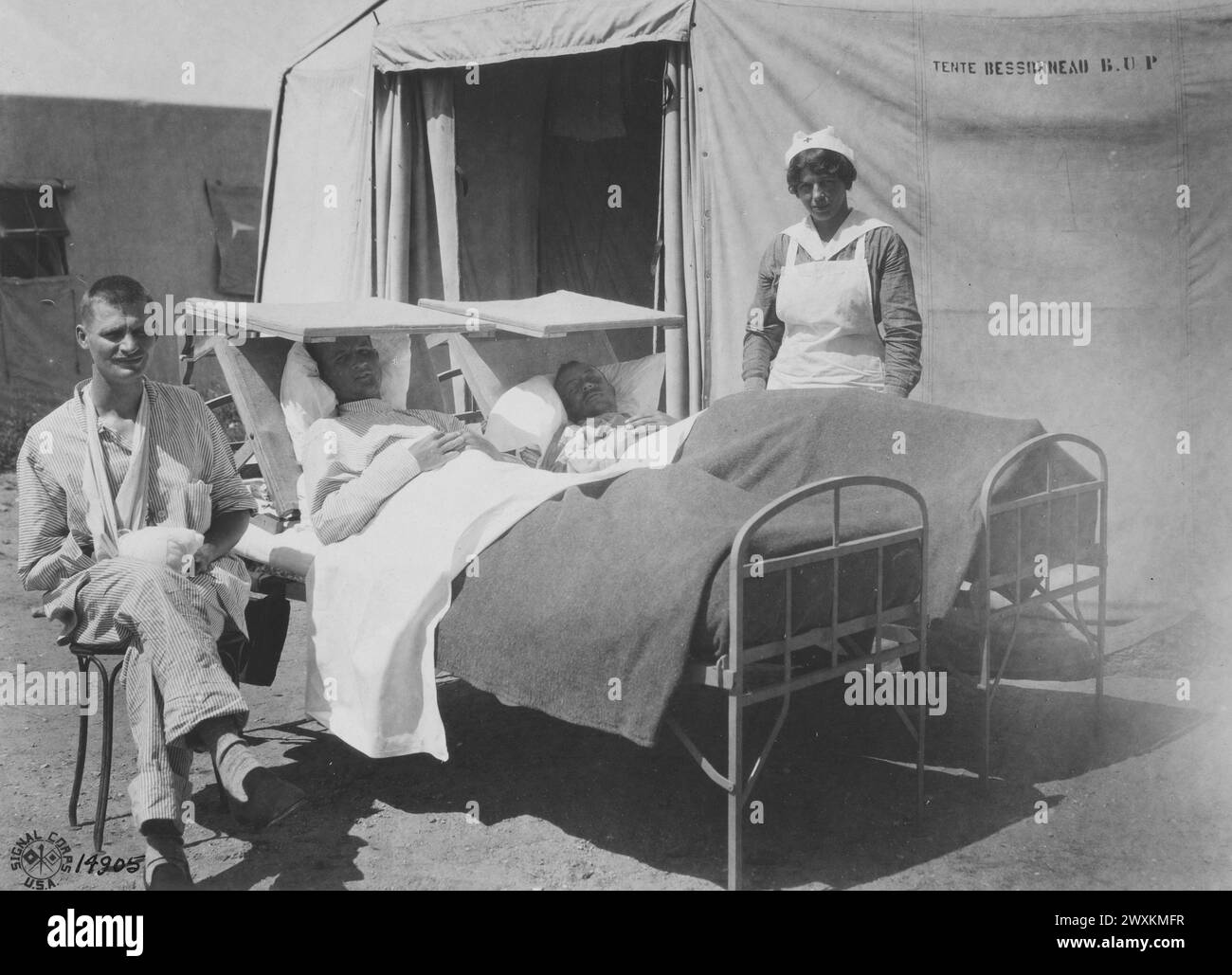 Patients taking a sun bath, along with their nurse, at an American Red Cross hospital in France ca. 1918 Stock Photo