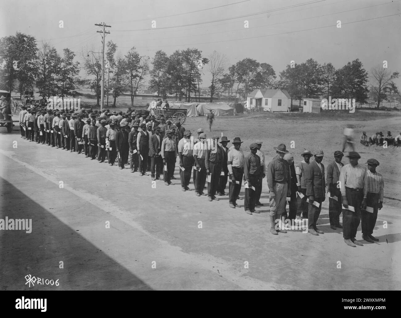 African American recruits wait in a line at Camp Meade, Admiral