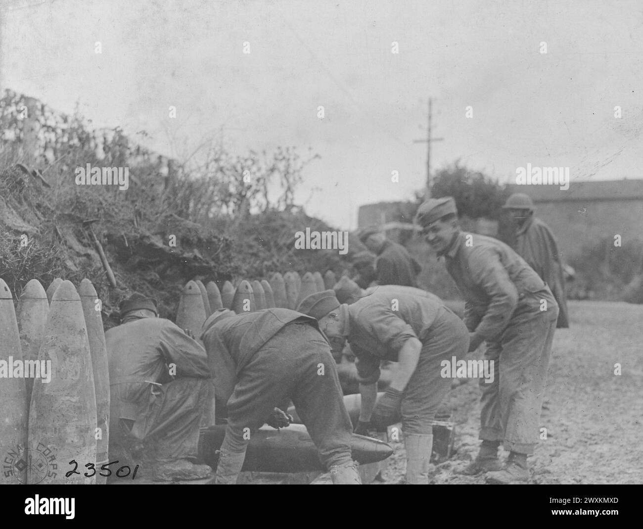 Men of Battery B, 51st Coast Artillery, cleaning and oiling 240mm shells; Martincourt France ca. 1918 Stock Photo