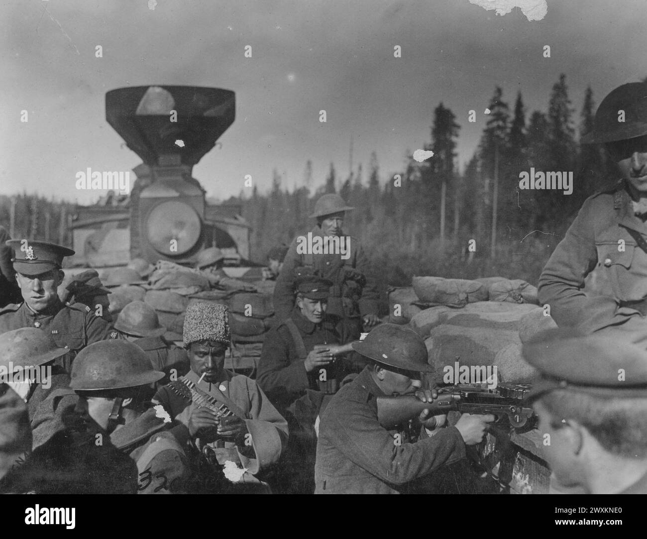 World War I Photos: American steel coal car lined with sandbags on allied armored train filled with Russian, English and Cossack soldiers near Obozerskaya Russia ca. 1918 Stock Photo