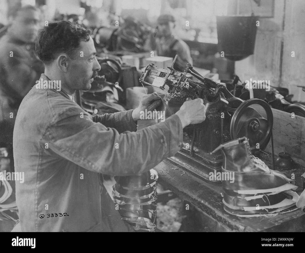 Manufacturing U.S. Army Shoes Man operating a machine which inserts