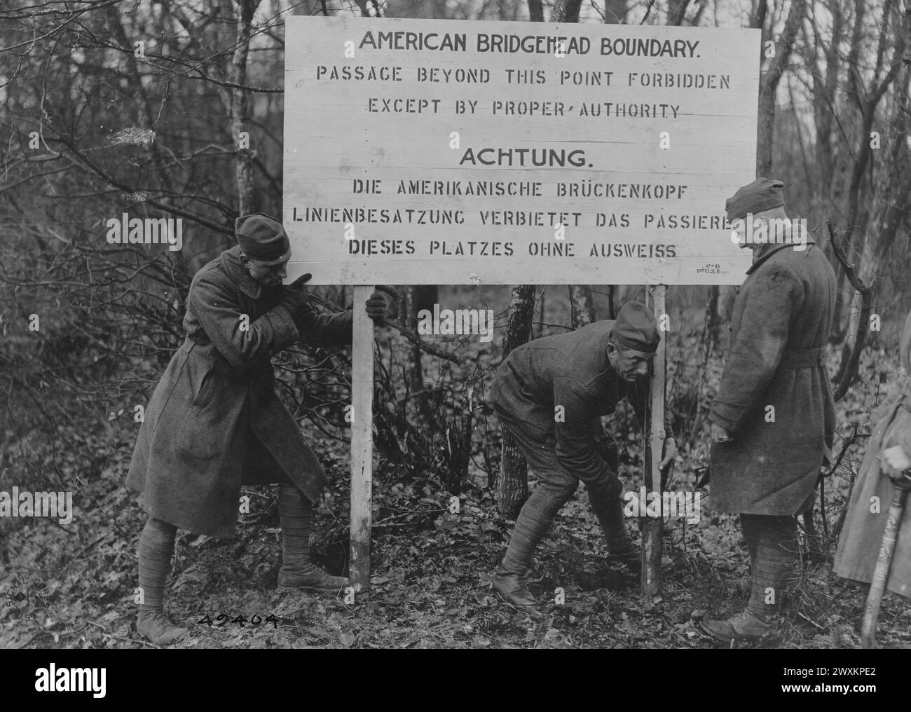 SIGN INDICATING NEUTRAL ZONE and farthest outpost of American Army of Occupation. In accordance with Armistice terms. Sign reads: 'American Bridgehead Boundary, Passage beyond this point forbidden except by proper authority' ca. December 1918 Stock Photo