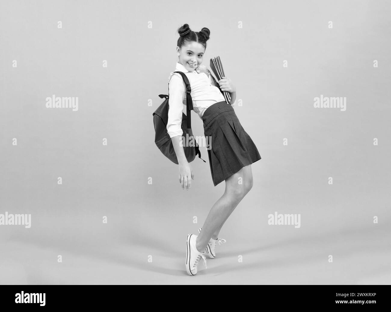 Happy school teenage girl with book and copybook. Teenager schoolgirl ...