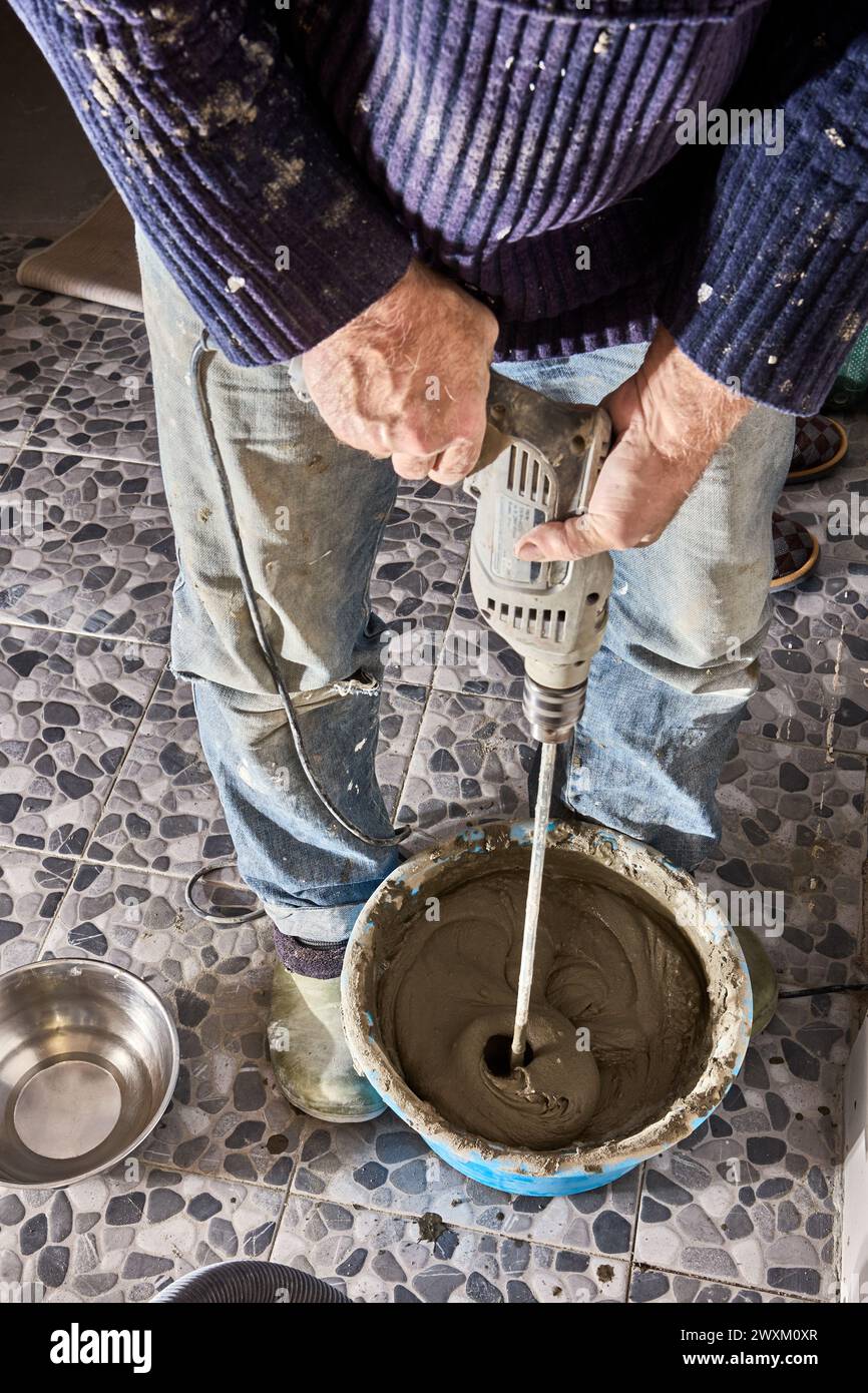 Attachment of hand mixer paddle for power drill for mixing cement