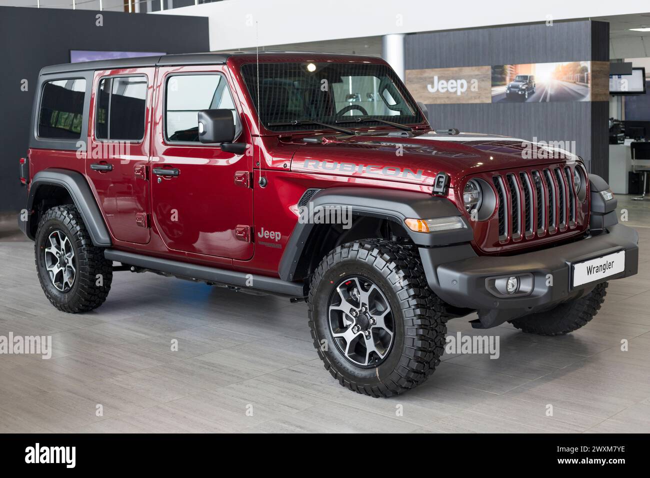 Russia, Izhevsk - March 4, 2022: Jeep showroom. New Wrangler Unlimited in dealer showroom. Front and side view. Off-road vehicles. Alliance Stellantis Stock Photo
