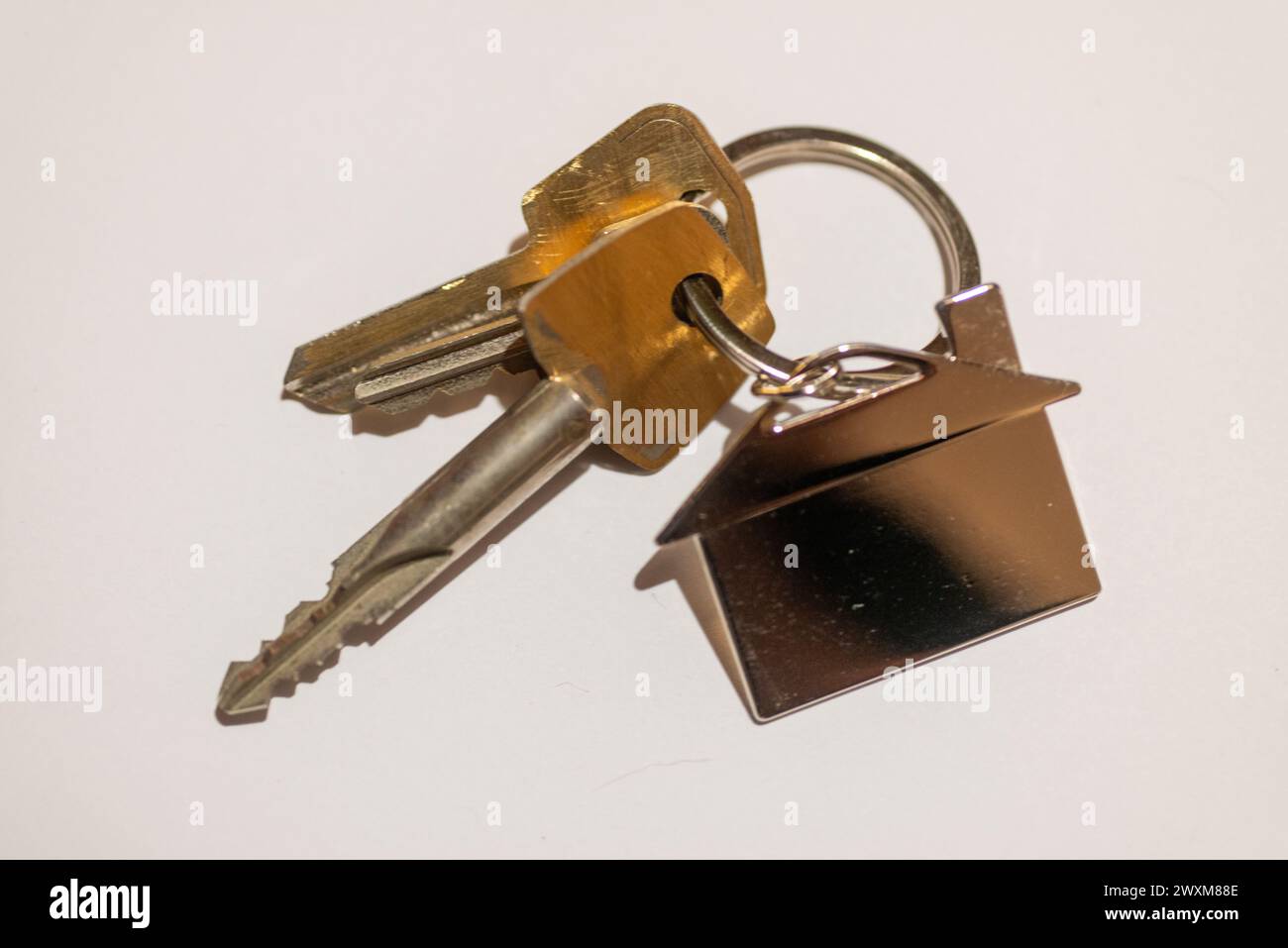 A close-up of keys on a plain background. Stock Photo