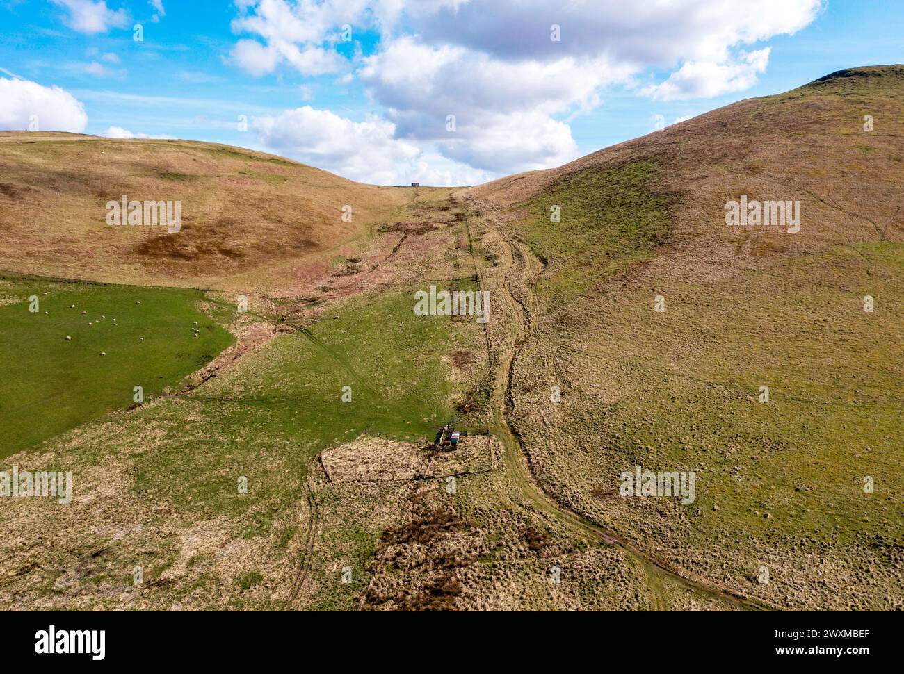 Aerial drone view of the route of Dere Street Roman road looking south towards Woden Law, Towford, Jedburgh, Scotland. Stock Photo