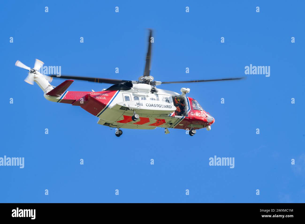 Sikorsky S-92A HM Coastguard SAR helicopter on a rescue mission alongside the Swaledale Mountain Rescue to attend a casualty in the Yorkshire Dales, U Stock Photo