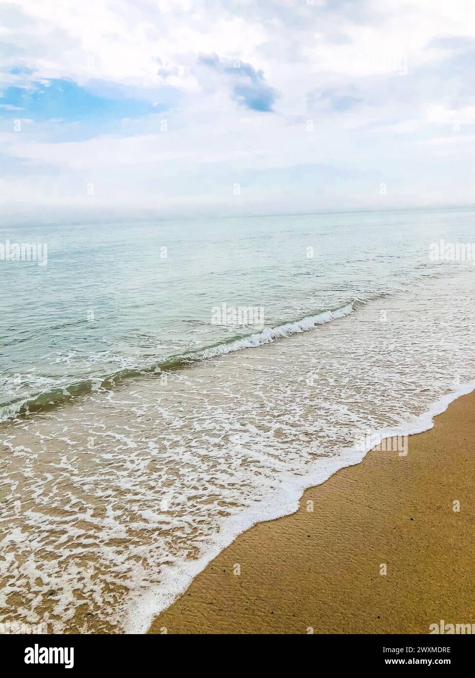Rolling calm waves on beautiful beach. Stock Photo