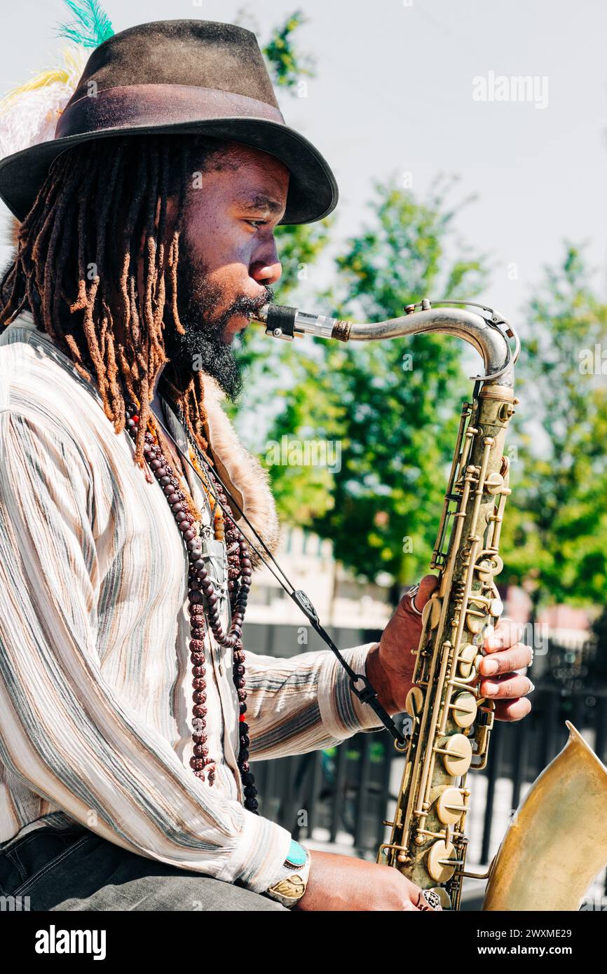 African American musician street performer playing sax, New Orleans Stock Photo