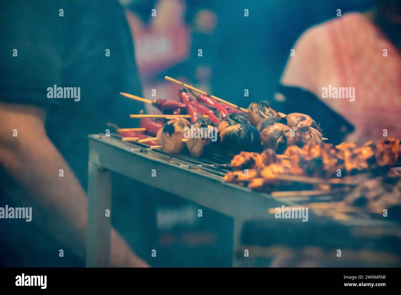 Chicken and lamb kebab skewers being barbequed at a street stall in Lakemba, Sydney, Australia during Ramadan and the 2024 Ramadan Nights Festival Stock Photo