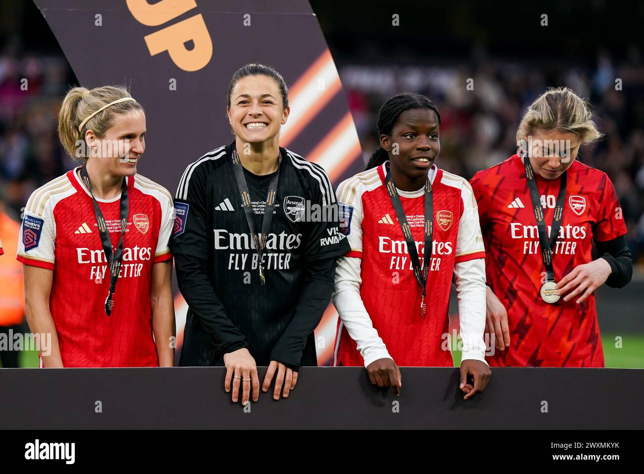 Wolverhampton, UK. 31st Mar, 2024. Wolverhampton, England, March 31st 2024: Cloe Lacasse (24 Arsenal), Goalkeeper Sabrina D'Angelo (14 Arsenal), Vivienne Lia and Naomi Williams (Arsenal) celebrating their victory during the trophy ceremony during the Womens FA Continental Tyres League Cup Final match between Arsenal and Chelsea at Molineux Stadium in Wolverhampton, England. (Daniela Porcelli/SPP) Credit: SPP Sport Press Photo. /Alamy Live News Stock Photo