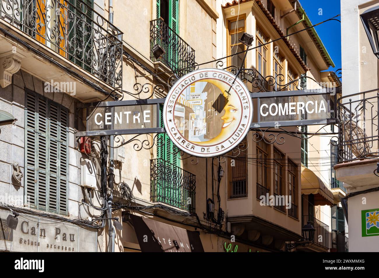 Centre Comercial sign above Carrer de Sa Lluna, a popular shopping street in Soller, Mallorca, Spain Stock Photo
