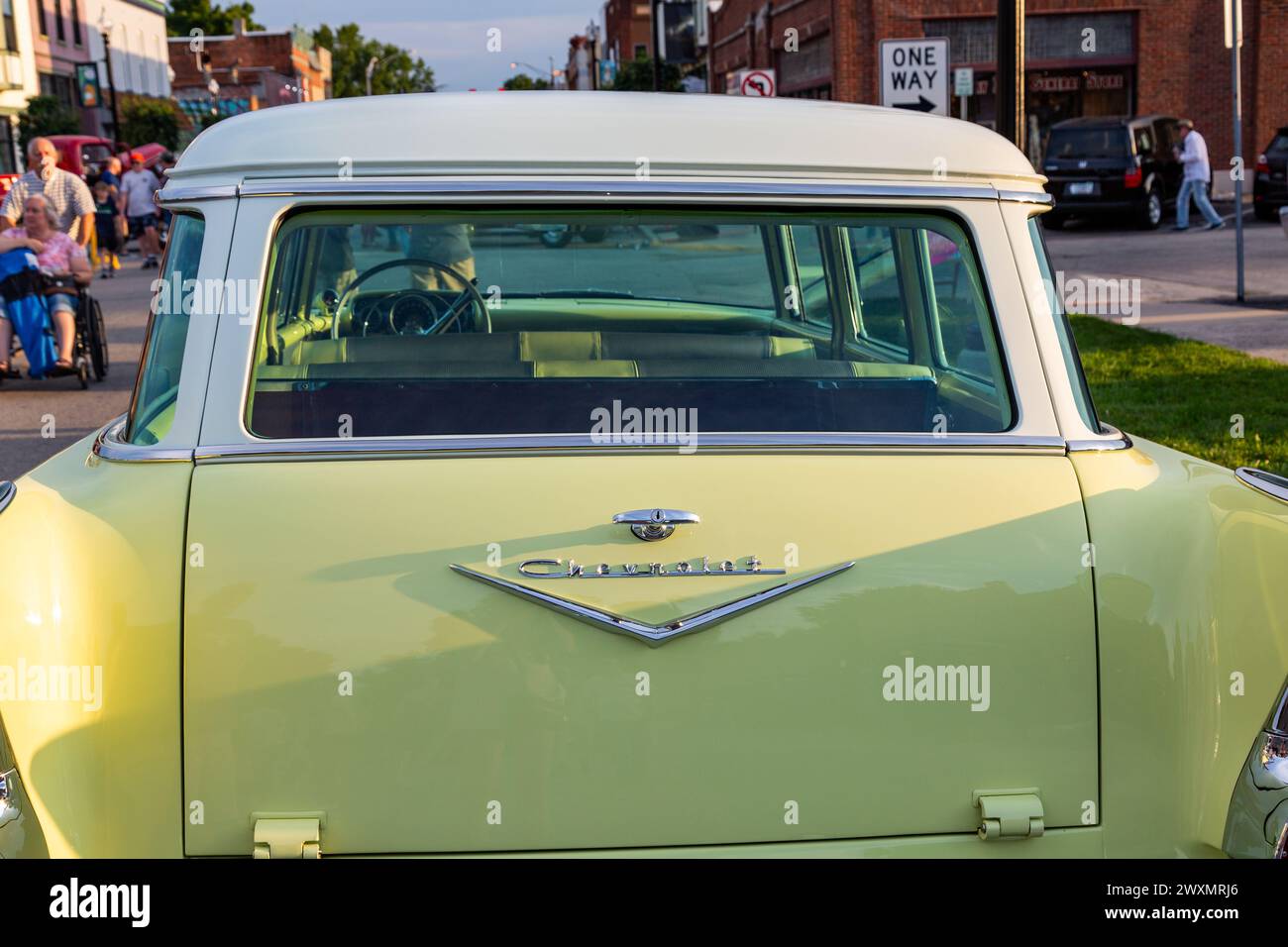 The tailgate and rear window of a yellow 1957 Chevrolet Two Ten station wagon on display at a car show in downtown Auburn, Indiana, USA. Stock Photo