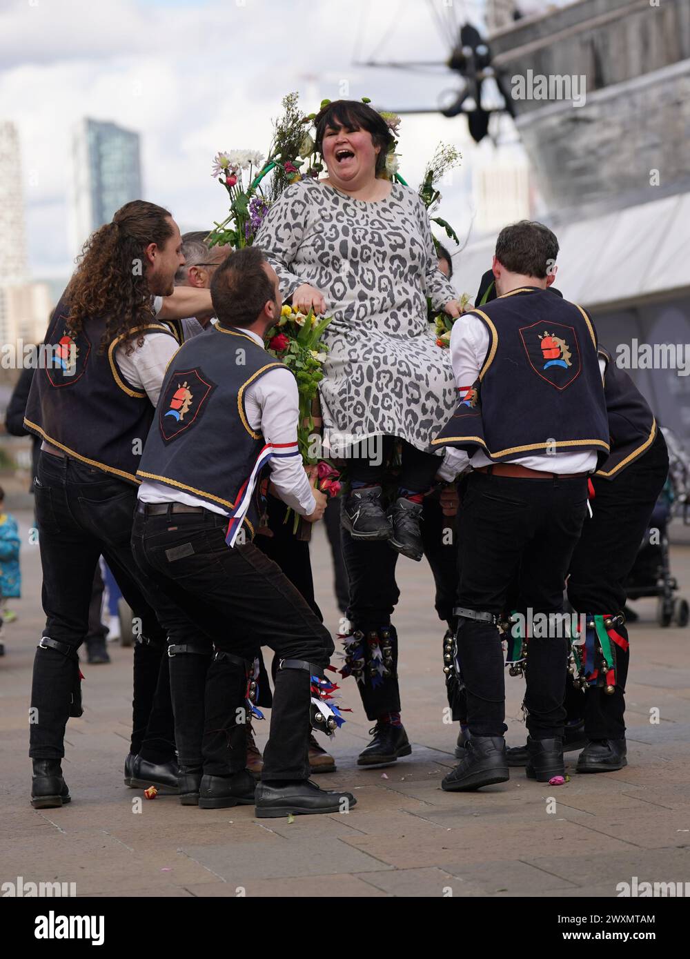 Members of the Blackheath Morris Men lift Liberty Rowley, from London ...