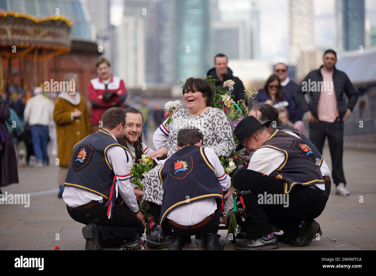 Members of the Blackheath Morris Men lift Liberty Rowley, from London ...
