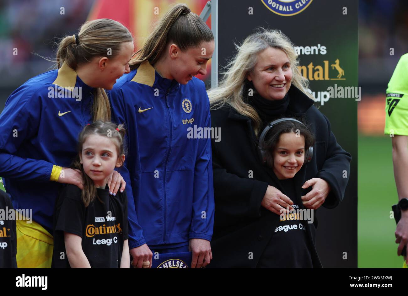 Wolverhampton, UK. 31st Mar, 2024. Emma Hayes, Manager of Chelsea interacts with a mascot prior to the The FA Women's Continental League Cup match at Molineux, Wolverhampton. Picture credit should read: Cameron Smith/Sportimage Credit: Sportimage Ltd/Alamy Live News Stock Photo