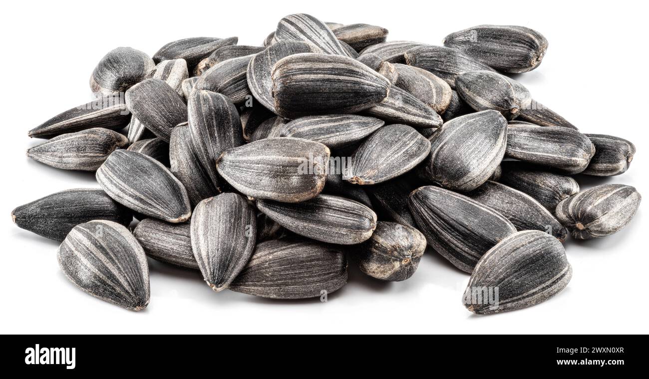 Pile of whole sunflower seeds isolated on white background Stock Photo ...