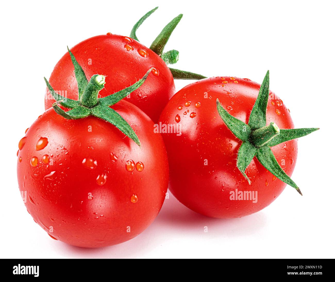 Washed cherry tomatoes with water drops isolated on white background. Macro shot. Popular worldwide product as ingredient in many mediterranean dishes Stock Photo