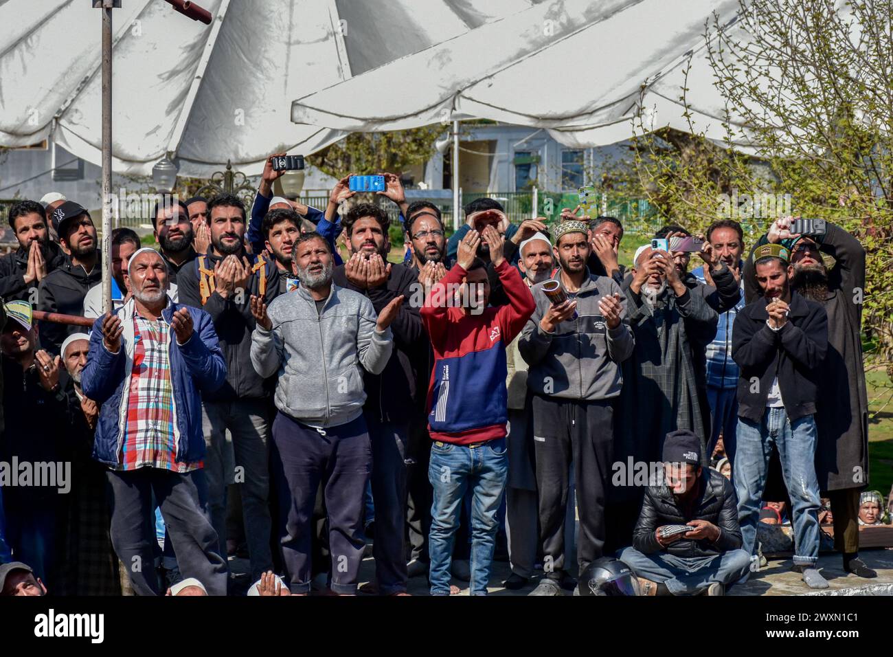 Srinagar, India. 01st Apr, 2024. Kashmiri Muslim devotees pray as a ...