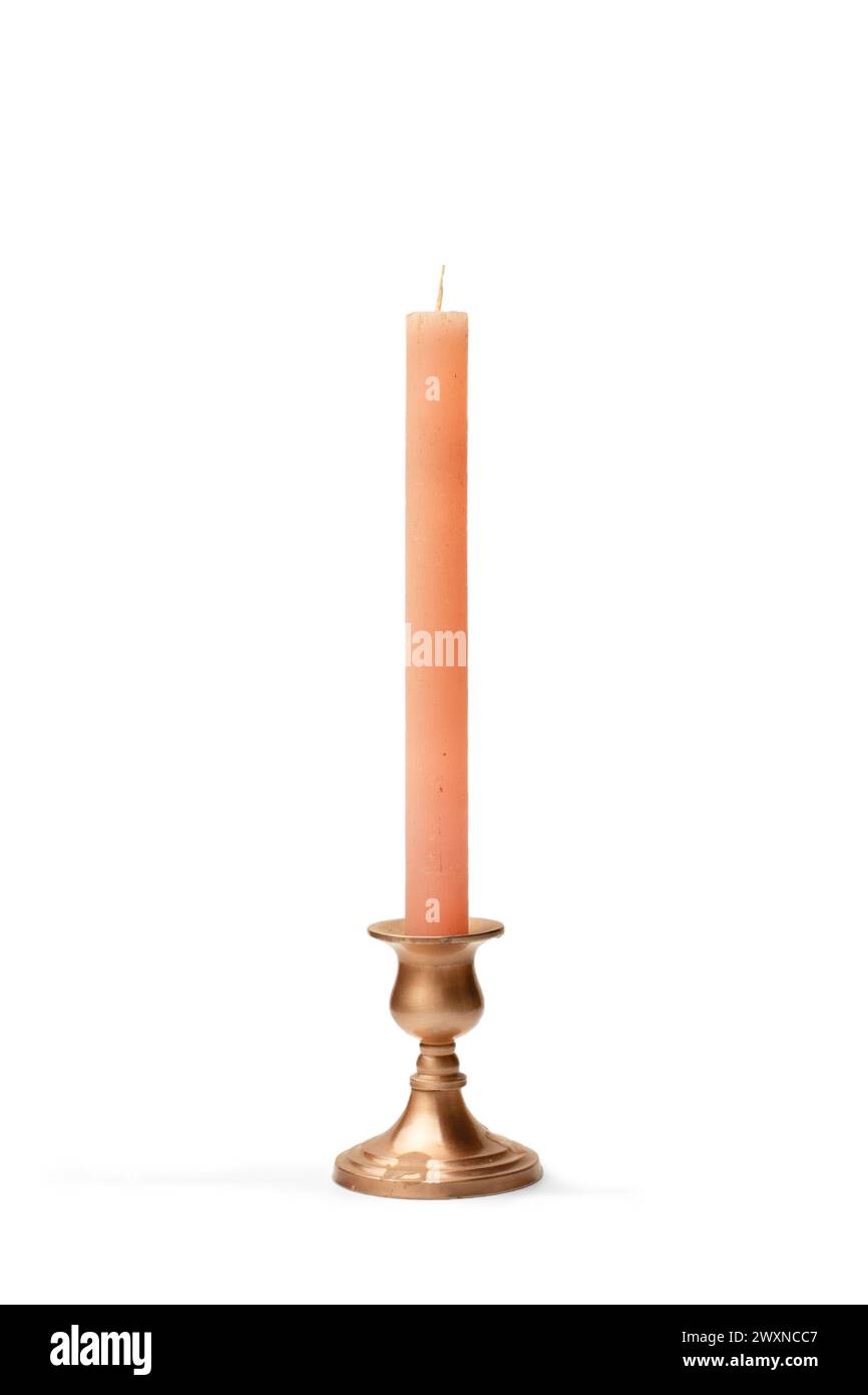 A copper chandelier with a pink candle on a white background with copy space Stock Photo