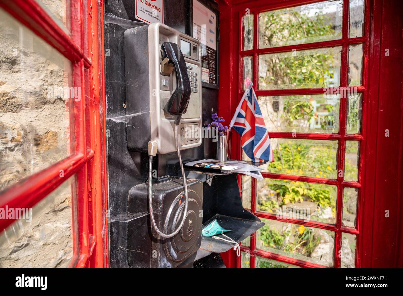 Red phone booth in Yorkshire Dales England Stock Photo