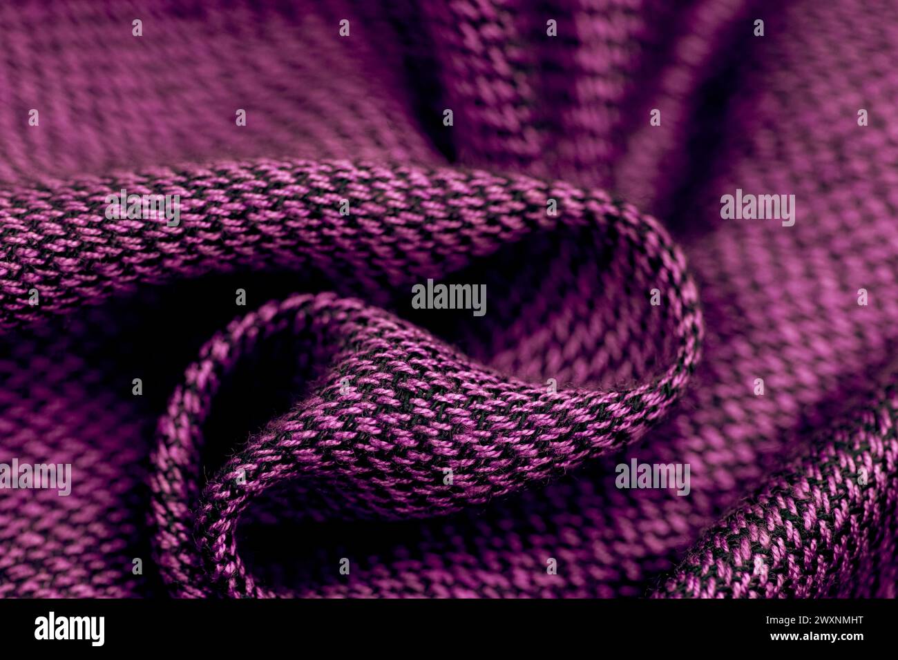 A purple knitted fabric texture background Stock Photo