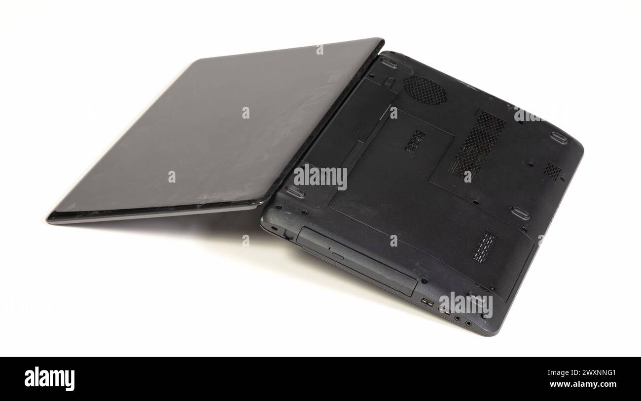 Partially Broken Computer Old broken laptop isolated on white a background Stock Photo - Alamy