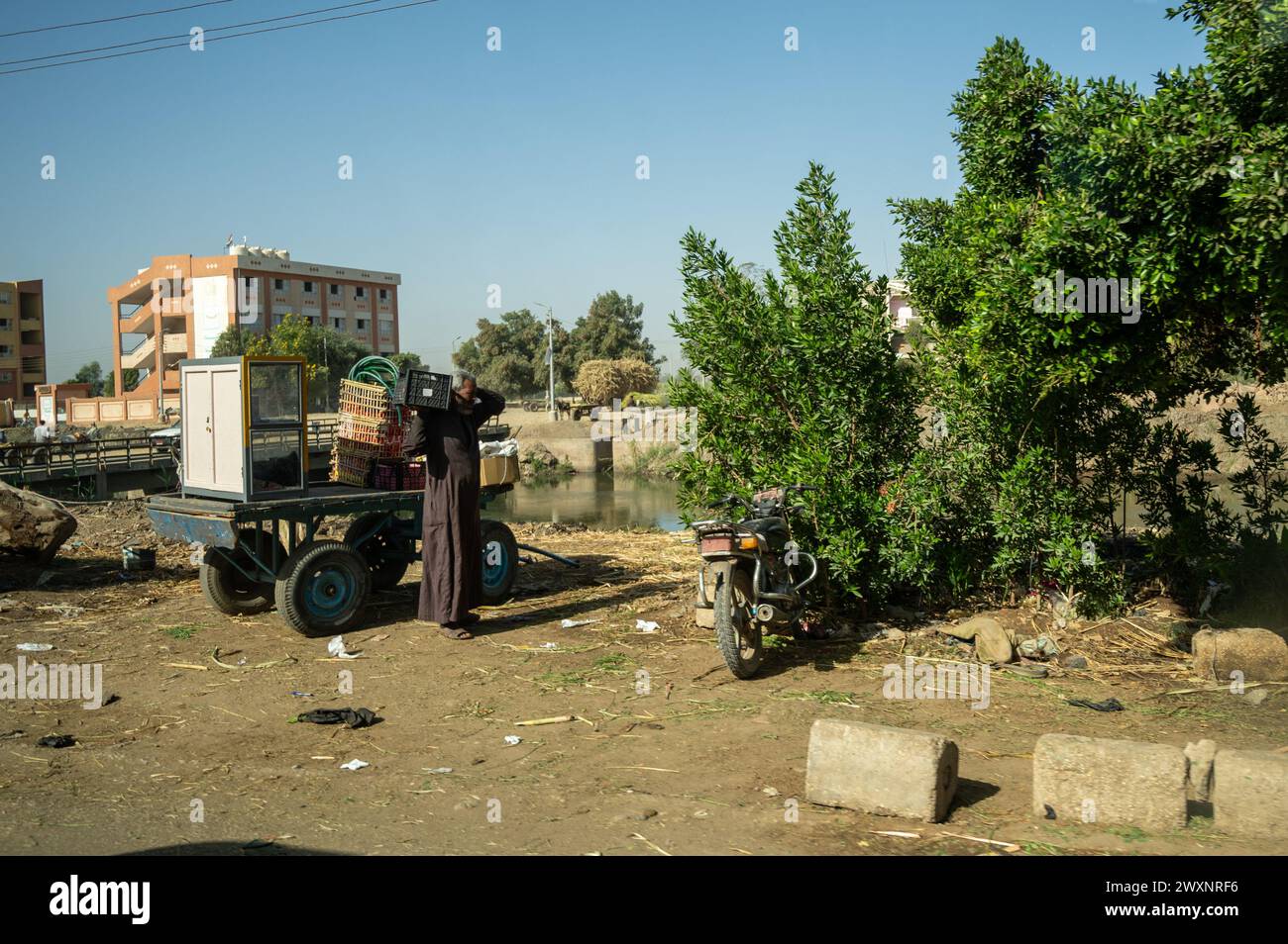 Egyptian trader selling fruits side of road Stock Photo