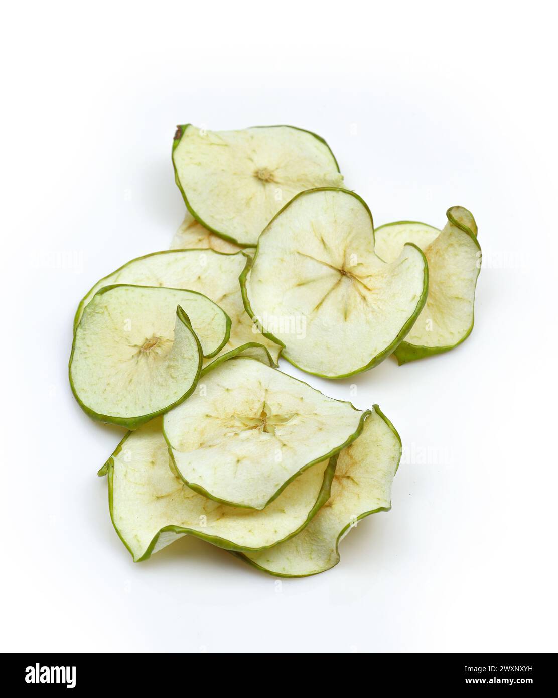 Pile of dry dehydrated green apple slices isolated on white background