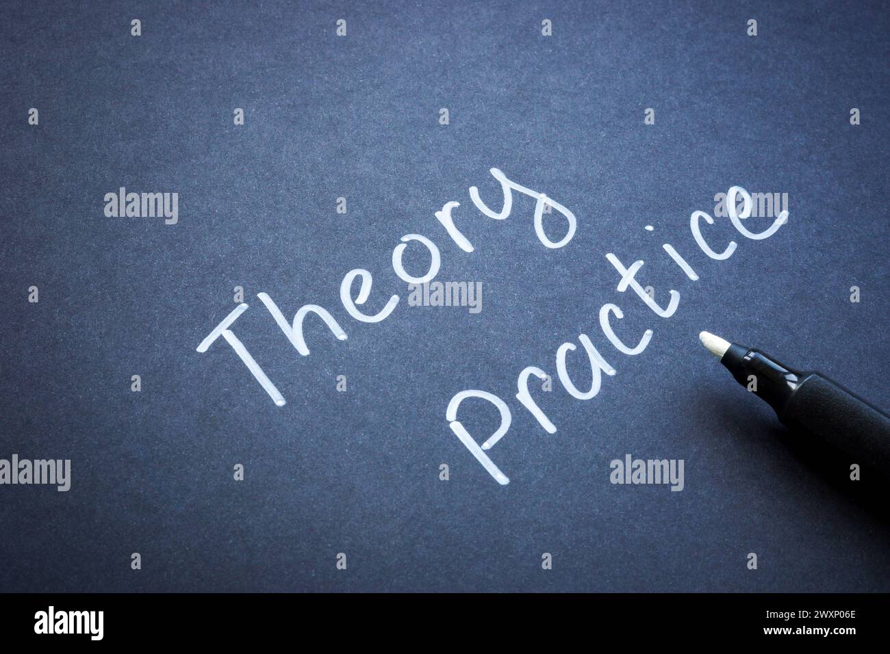 Handwritten marker words theory and practice Stock Photo - Alamy
