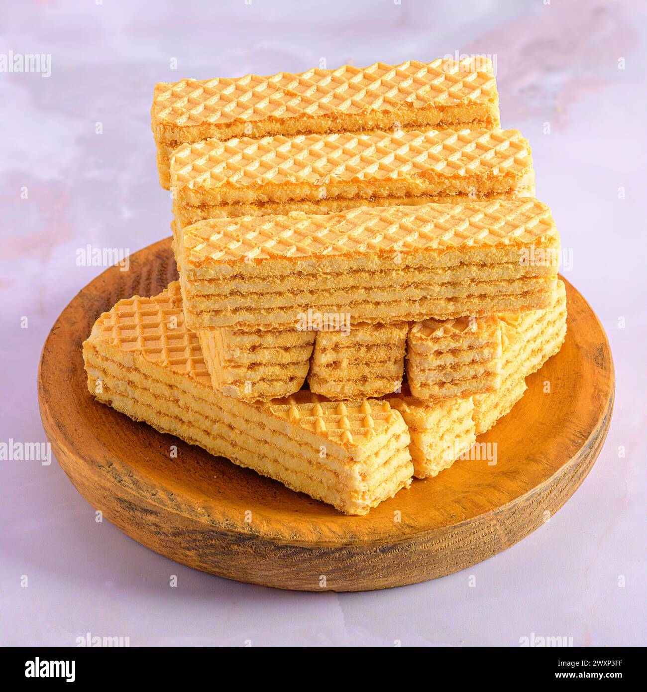 A Cream Biscuit Tower on Wooden Plate Stock Photo