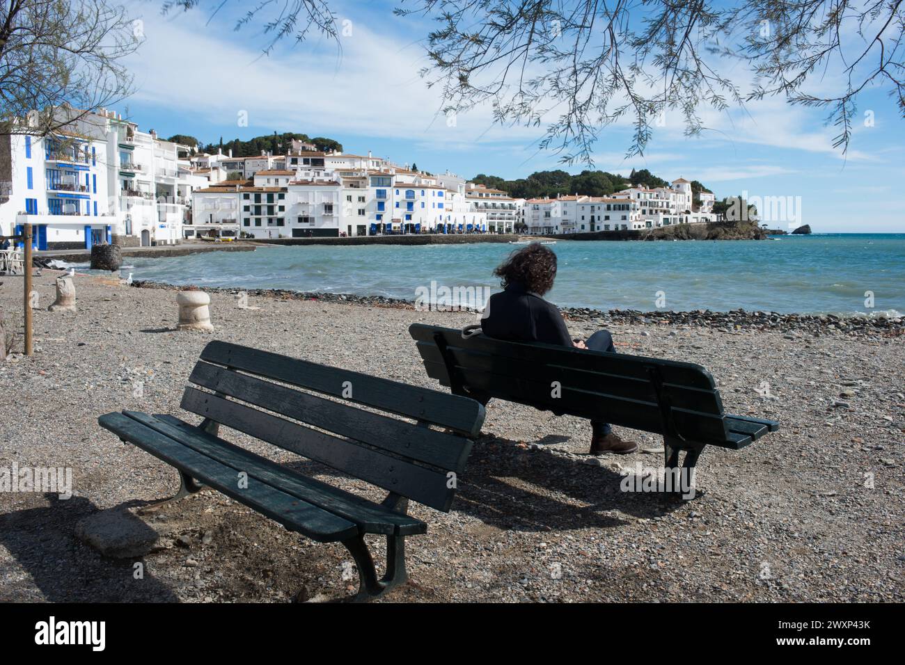 Rear View Of Unrecognizable Person Sitting On A Bench At Cadaques 