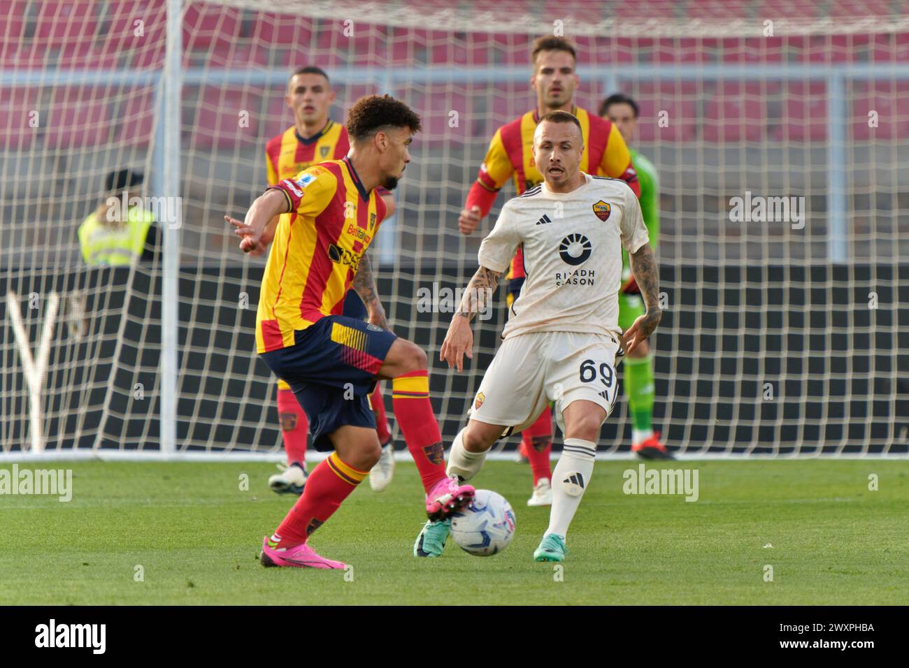 Lecce, Italy. 01st Apr, 2024. Valentin Gendrey of US Lecce and Jose Angel Esmoris Tasende Angelino of AS Roma during US Lecce vs AS Roma, Italian soccer Serie A match in Lecce, Italy, April 01 2024 Credit: Independent Photo Agency/Alamy Live News Stock Photo