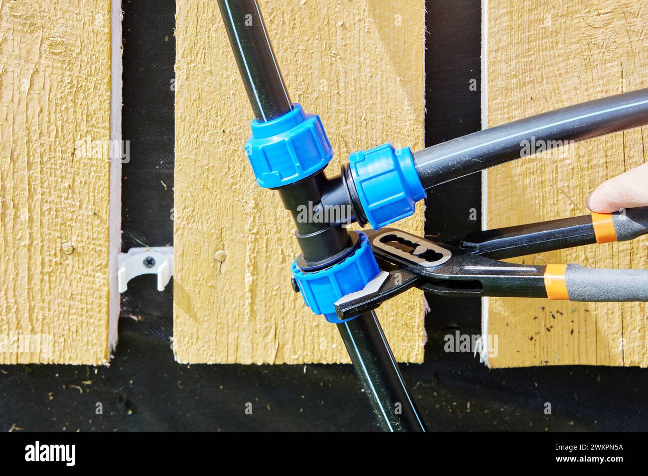 Adjustable wrench pliers is used to tighten fastening nut of