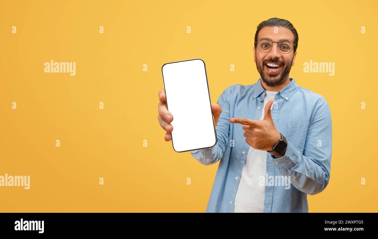 Man pointing at phone screen with smile Stock Photo