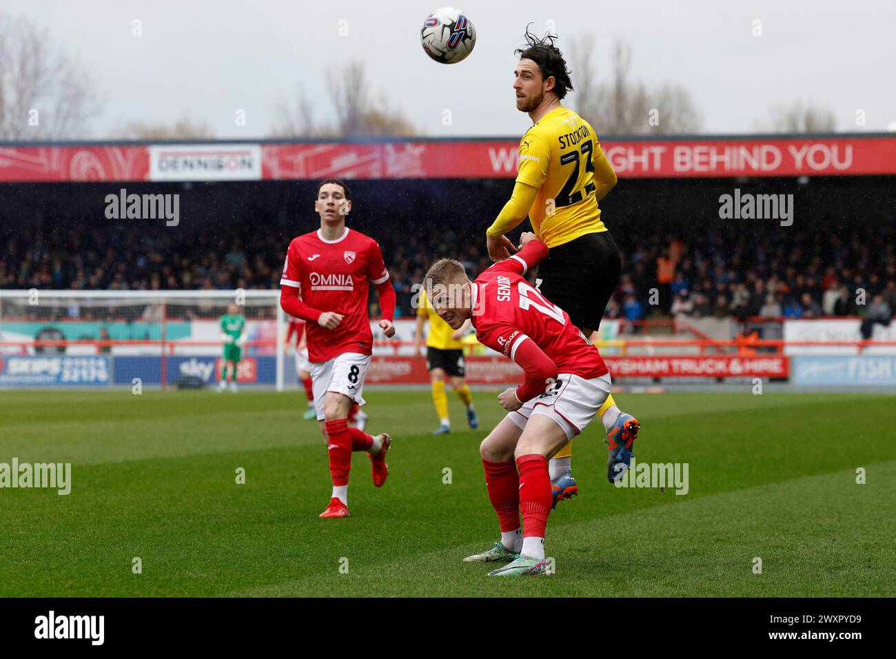 Morecambe on Monday 1st April 2024. Barrow's Cole Stockton challenges for a header with Morecambe's Joel Senior during the Sky Bet League 2 match between Morecambe and Barrow at the Globe Arena, Morecambe on Monday 1st April 2024. (Photo: Mark Fletcher | MI News) Credit: MI News & Sport /Alamy Live News Stock Photo