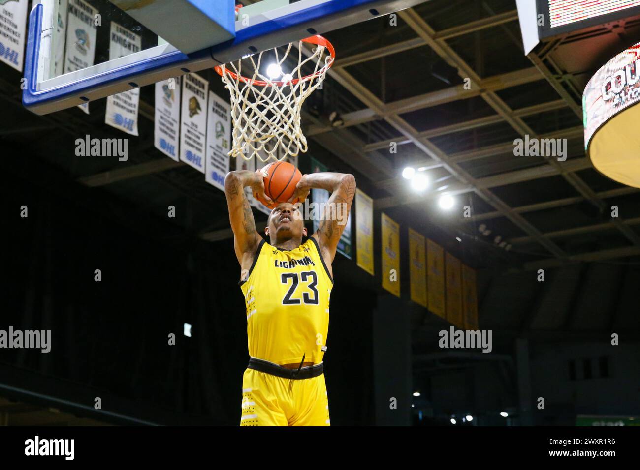 London, Canada. 1st Apr, 2024. The London Lightning lead the Newfoundland Rogues 60-56 at half time. Billy White (23) of the London Lightning goes for a dunk. Credit: Luke Durda/Alamy Live News Stock Photo