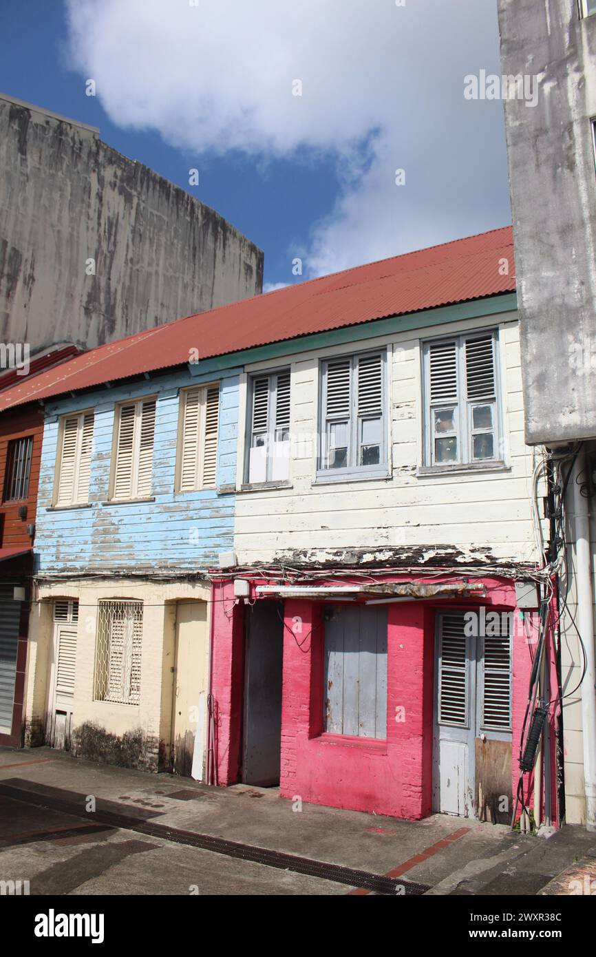 Colorful wooden rowhouses with peeling paint in Fort-de-France, Martinique Stock Photo