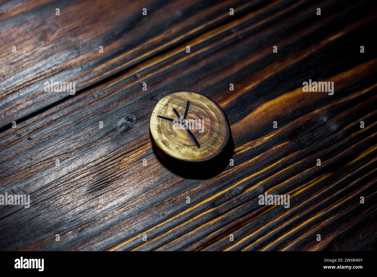 Rune Algiz (Elhaz) carved from wood on a wooden background - Elder ...