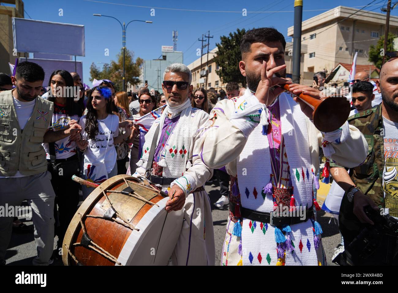 Dohuk, Iraq. 01st Apr, 2024. Two Assyrian musicians dressed traditional clothes perform during Aketo celebrations, the Assyrian New Year 6774, in Dohuk. Credit: SOPA Images Limited/Alamy Live News Stock Photo