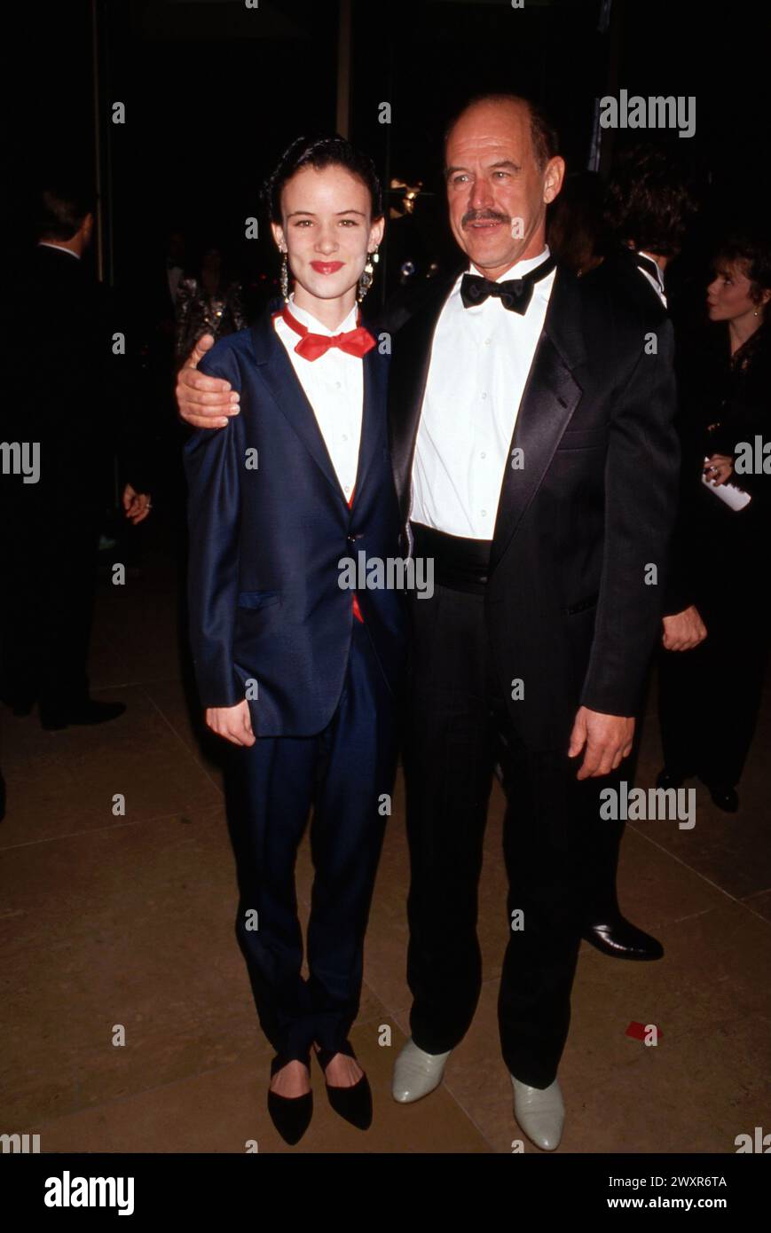 Juliette Lewis and father Geoffrey Lewis at the 49th Annual Golden Globe Awards on January 18, 1992 at the Beverly Hilton Hotel in Beverly Hills, California Credit: Ralph Dominguez/MediaPunch Stock Photo