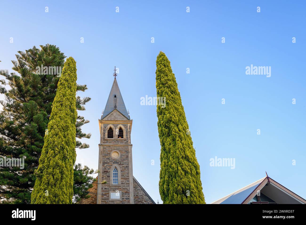 Langmeil Lutheran Church with the long pathway between pencil pines in Tanunda during sunset, Barossa Valley, South Australia Stock Photo