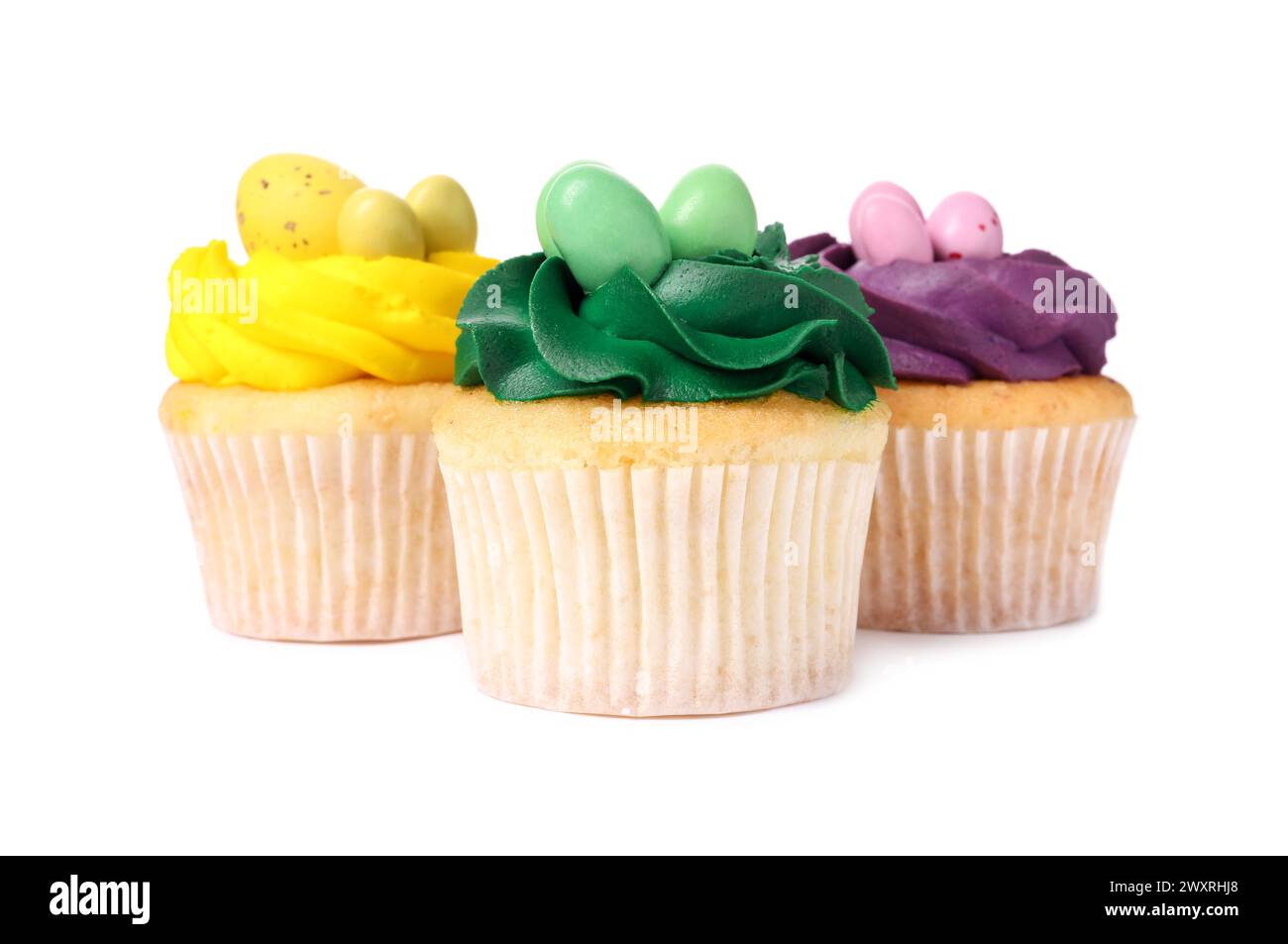 Tasty decorated Easter cupcakes isolated on white Stock Photo